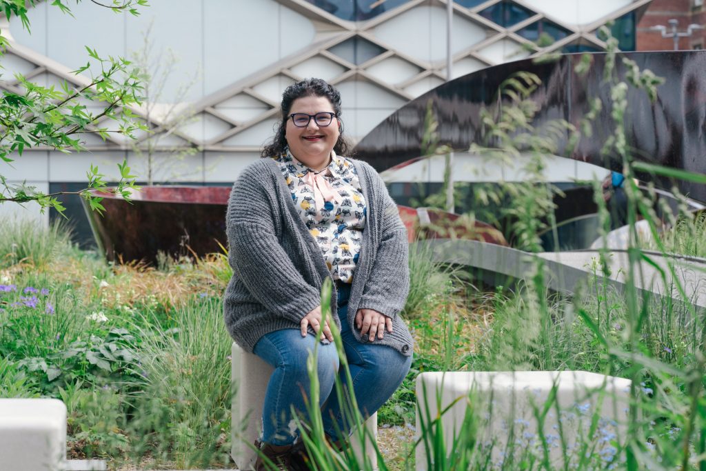 Roberta sitting outside the Grantham Centre where she studies GMOs and food sustainability