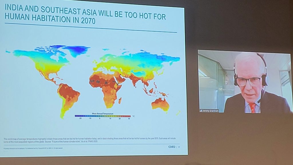 Jeremy Grantham on a screen next to a slide called 'India and Southeast Asia will be too hot for human habitation in 2070'.