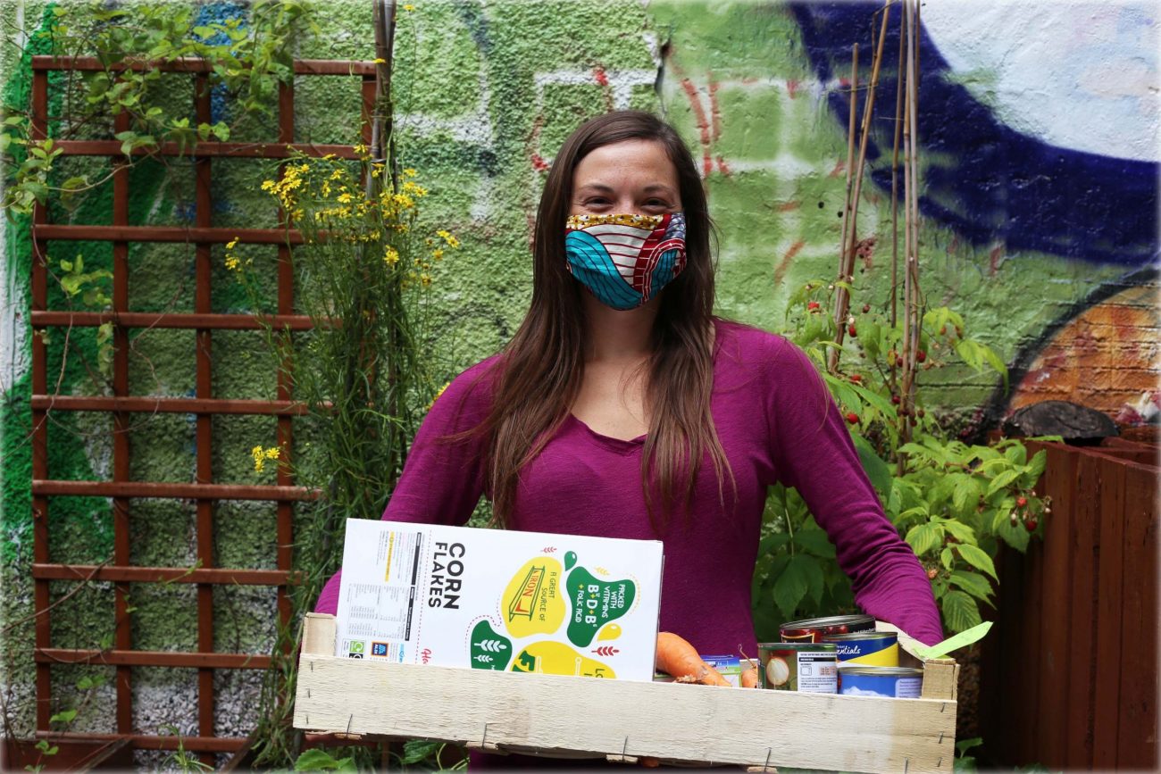 Nicole Kennard with mask and box of food
