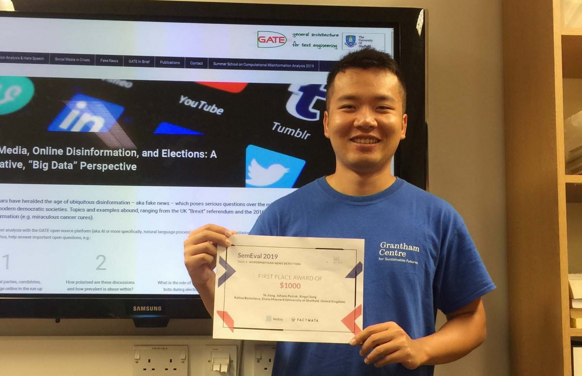 Ye showing his certificate for the competition win for Hyperpartisan News Detection Challenge